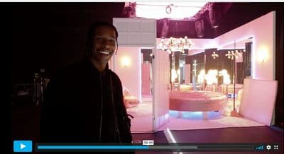a man standing in front of a mirror in a room