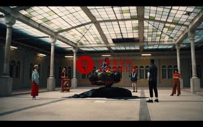 a group of people standing in a large room