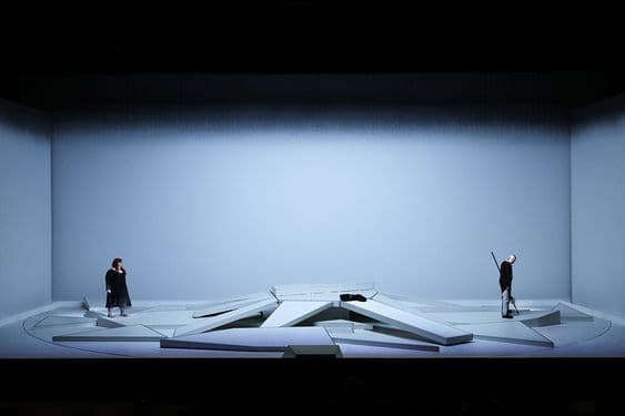 a couple of people standing on top of a stage