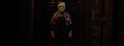 a creepy looking person with a scarf around his neck