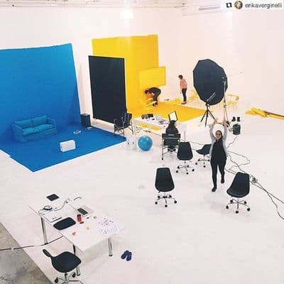a group of people standing around a room