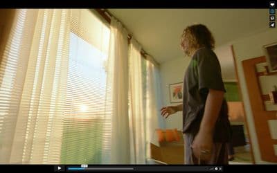 a man is standing in front of a window