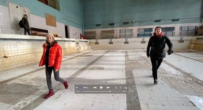 a couple of people that are standing in a room