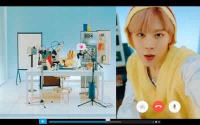a person in a room with a table and a microphone
