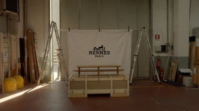 a room with a sign that says hermes farms