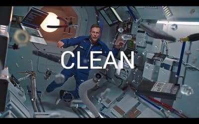 a man in a space station with the words clean