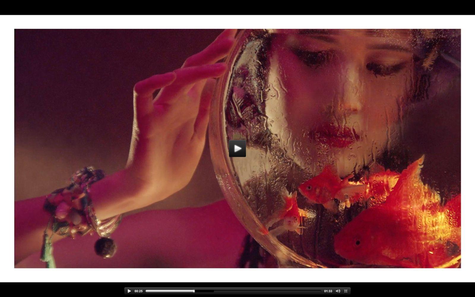 a woman looking at her reflection in a mirror