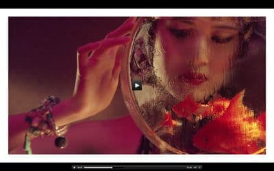 a woman looking at her reflection in a mirror