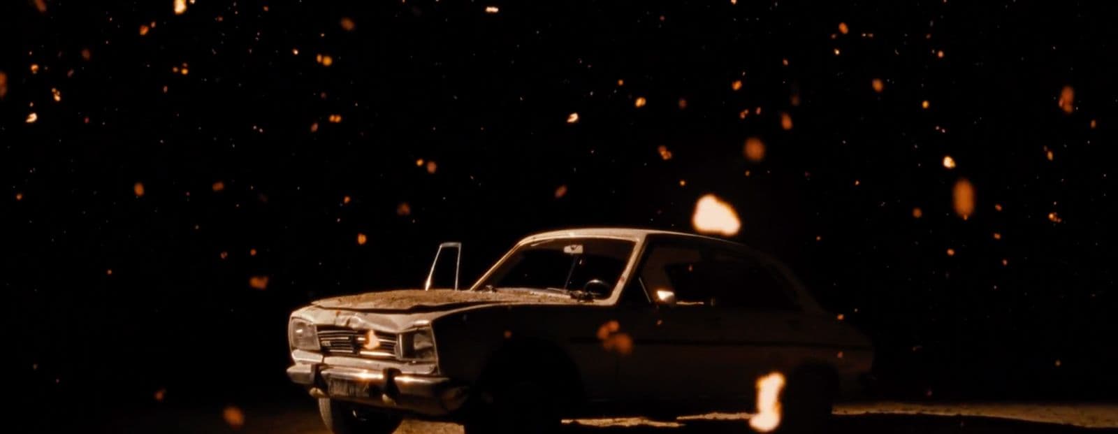 a truck parked in the dark on a snowy night