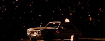 a truck parked in the dark on a snowy night