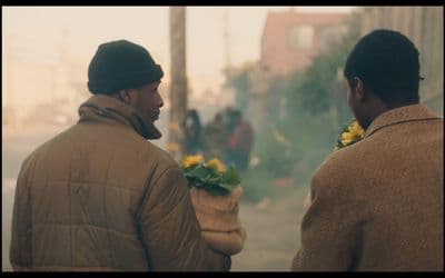 a couple of men standing next to each other
