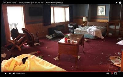 a messy room with a bed and a desk