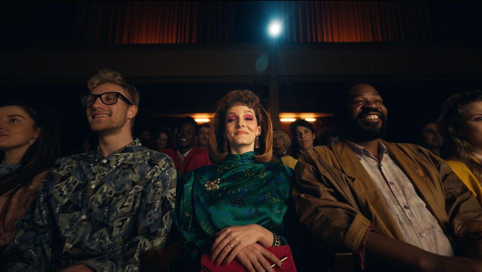 a group of people sitting next to each other