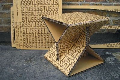 two cardboard boxes are stacked on top of each other