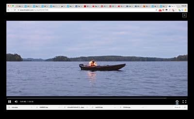 two people in a boat on a lake
