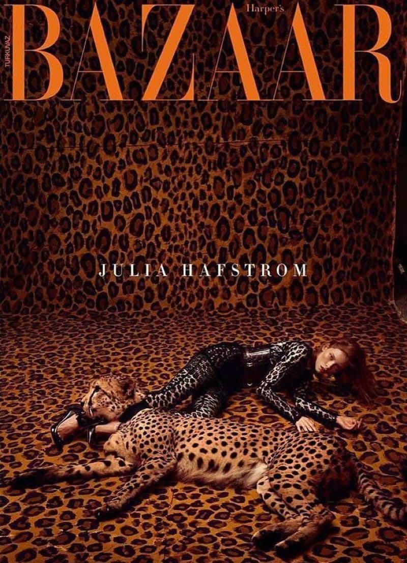 a leopard print with a woman laying on top of it