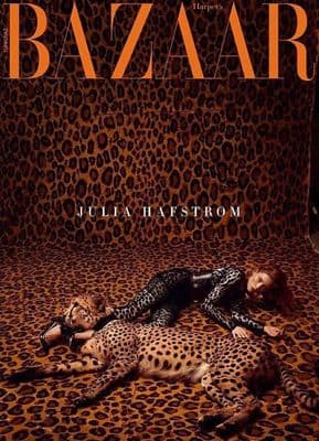 a leopard print with a woman laying on top of it