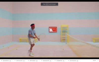 a man holding a tennis racquet on top of a tennis court
