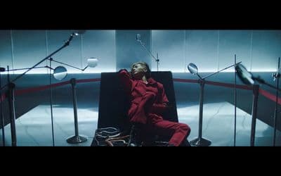 a woman sitting in a chair in a room