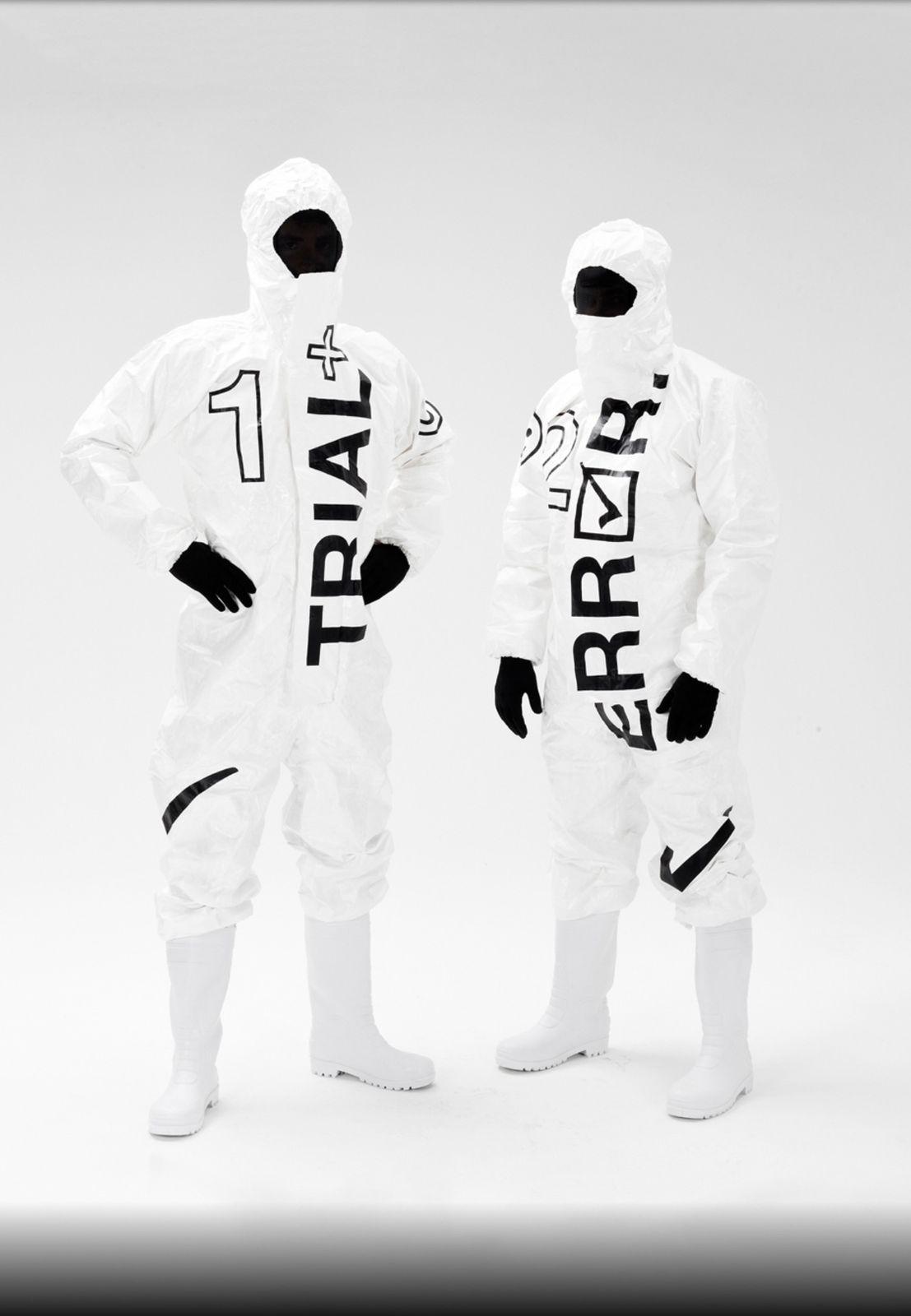 a couple of people in white suits standing next to each other