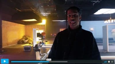 a man standing in a room with a microphone