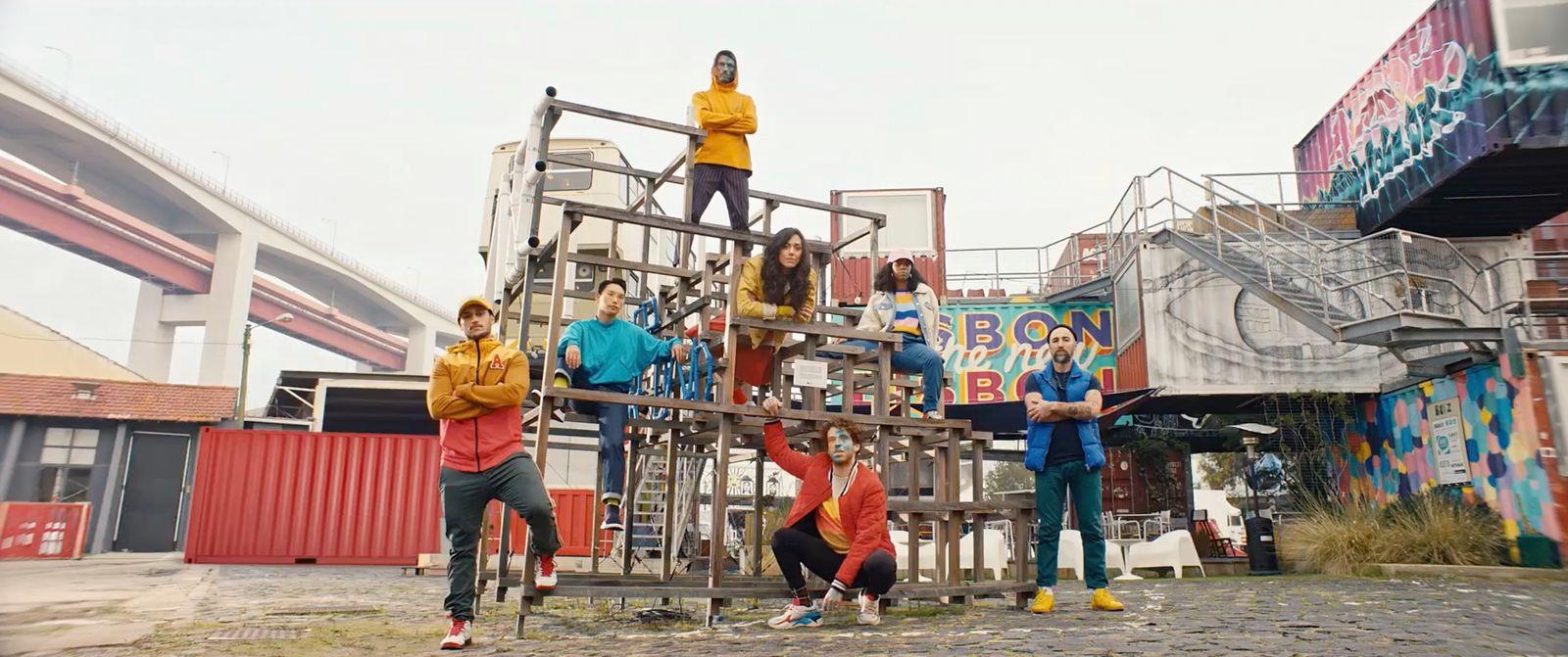 a group of people standing on top of a wooden structure
