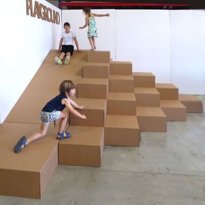 a group of children playing on a set of stairs