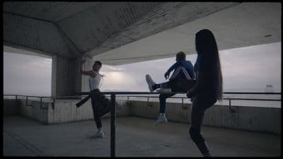 a group of people standing on top of a roof