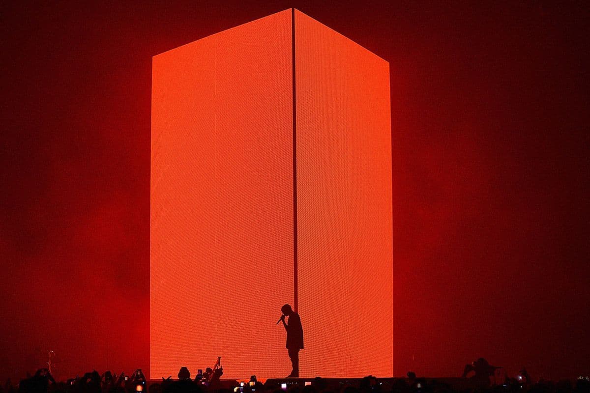 a person standing in front of a giant red object
