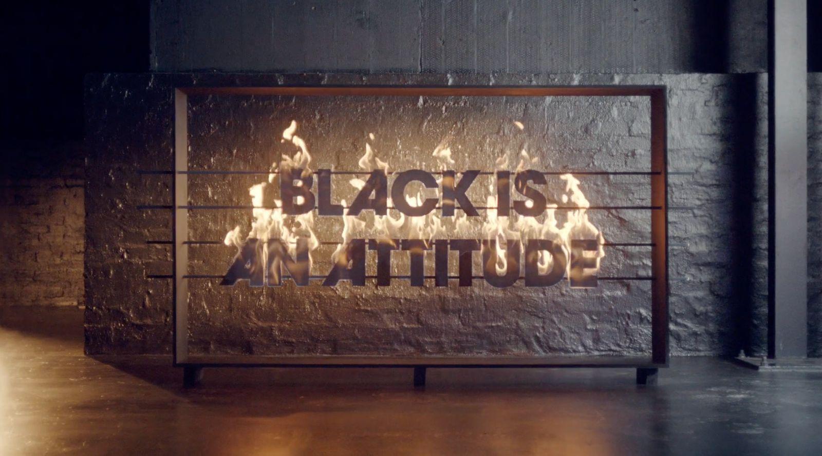 a sign that reads black is a beautiful attitude