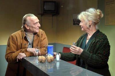a man and a woman sitting at a table