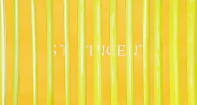 a yellow wall with white writing on it