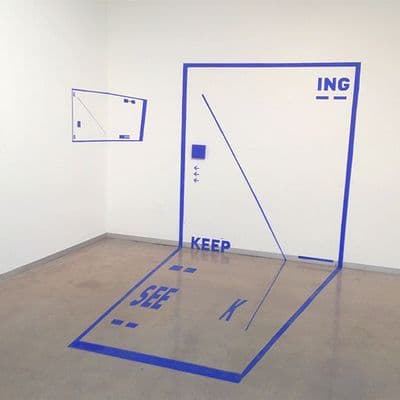 a room with a door and a sign on the floor