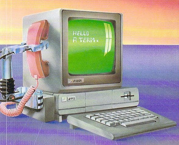 an old computer with a green screen and keyboard