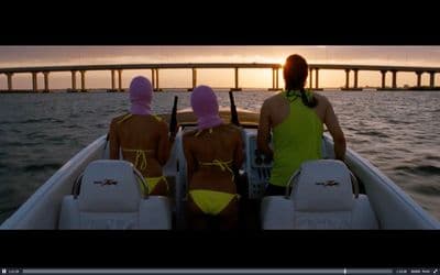 a couple of people in a boat on a body of water