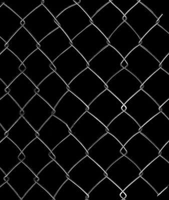 a black and white photo of a chain link fence