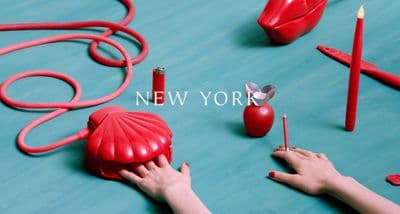 a person holding a red object in their hand