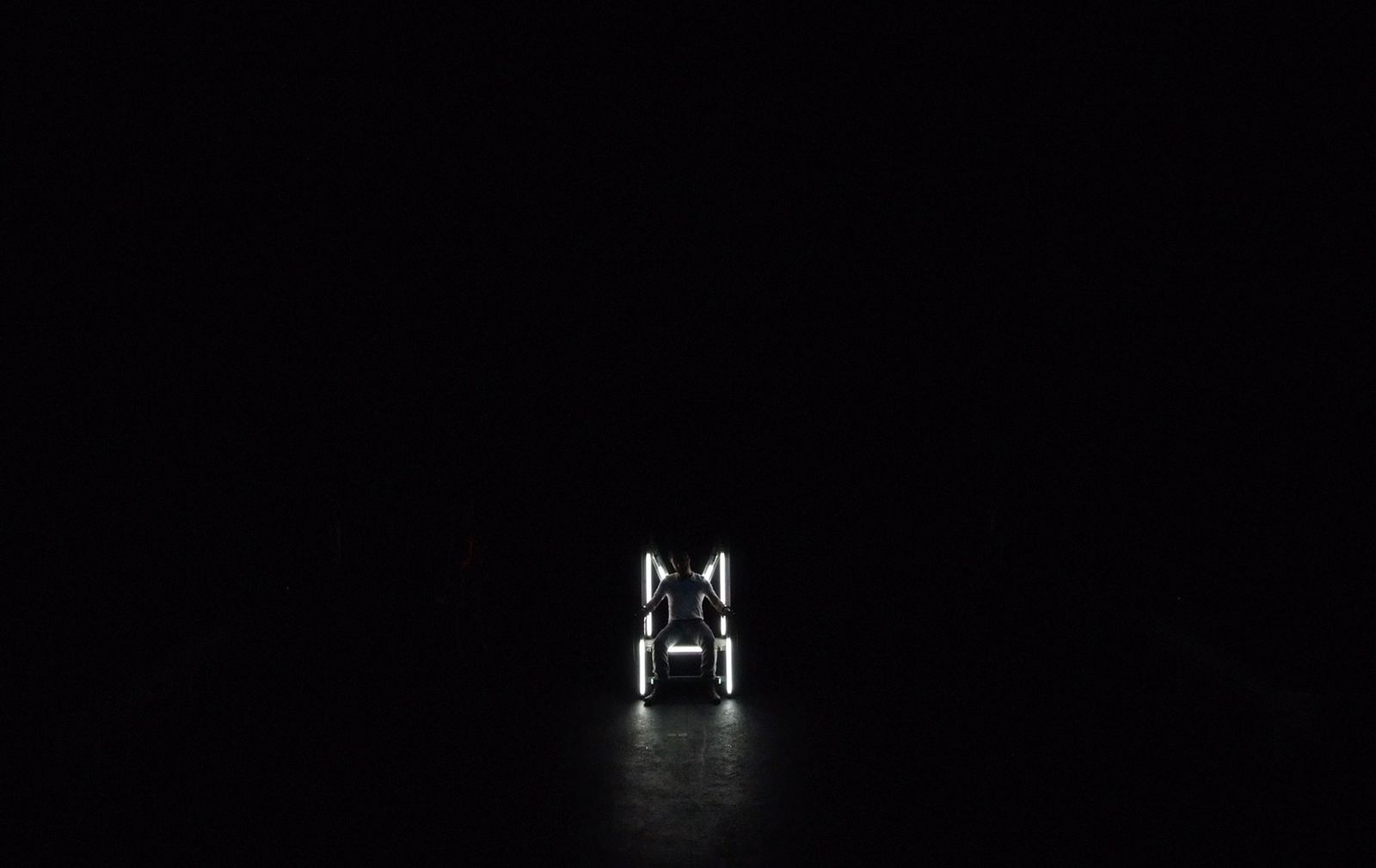 a person standing in the dark in the dark