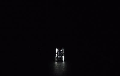 a person standing in the dark in the dark