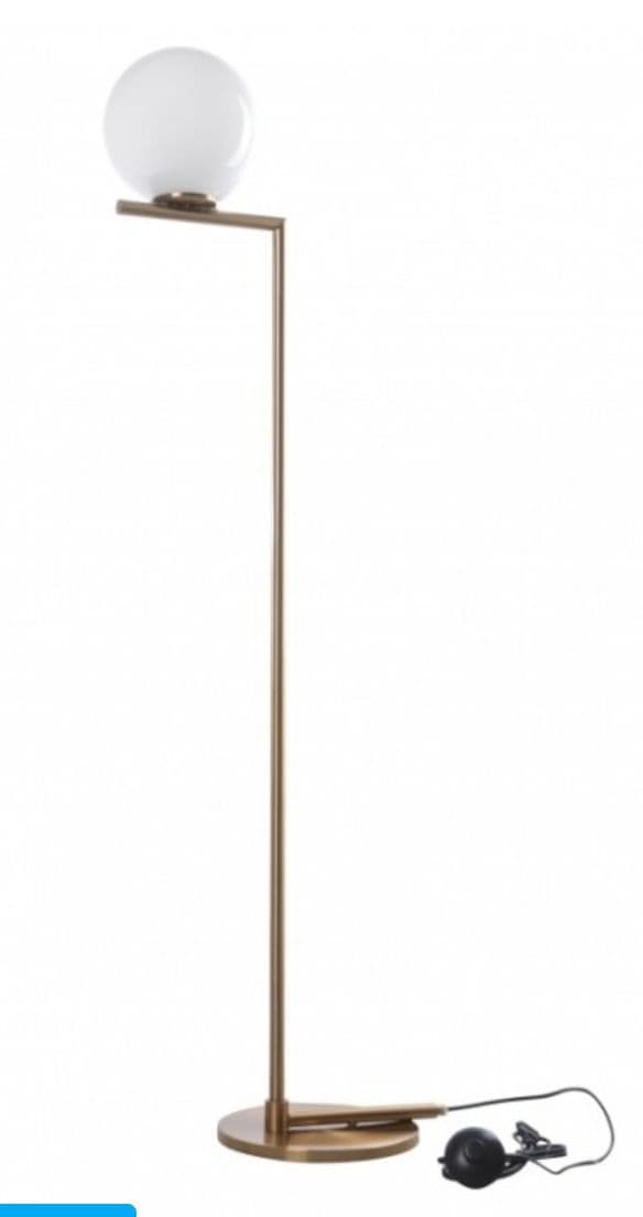 a lamp that is on top of a stand