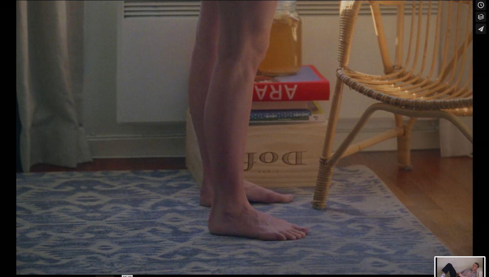 a person standing on a rug in a room