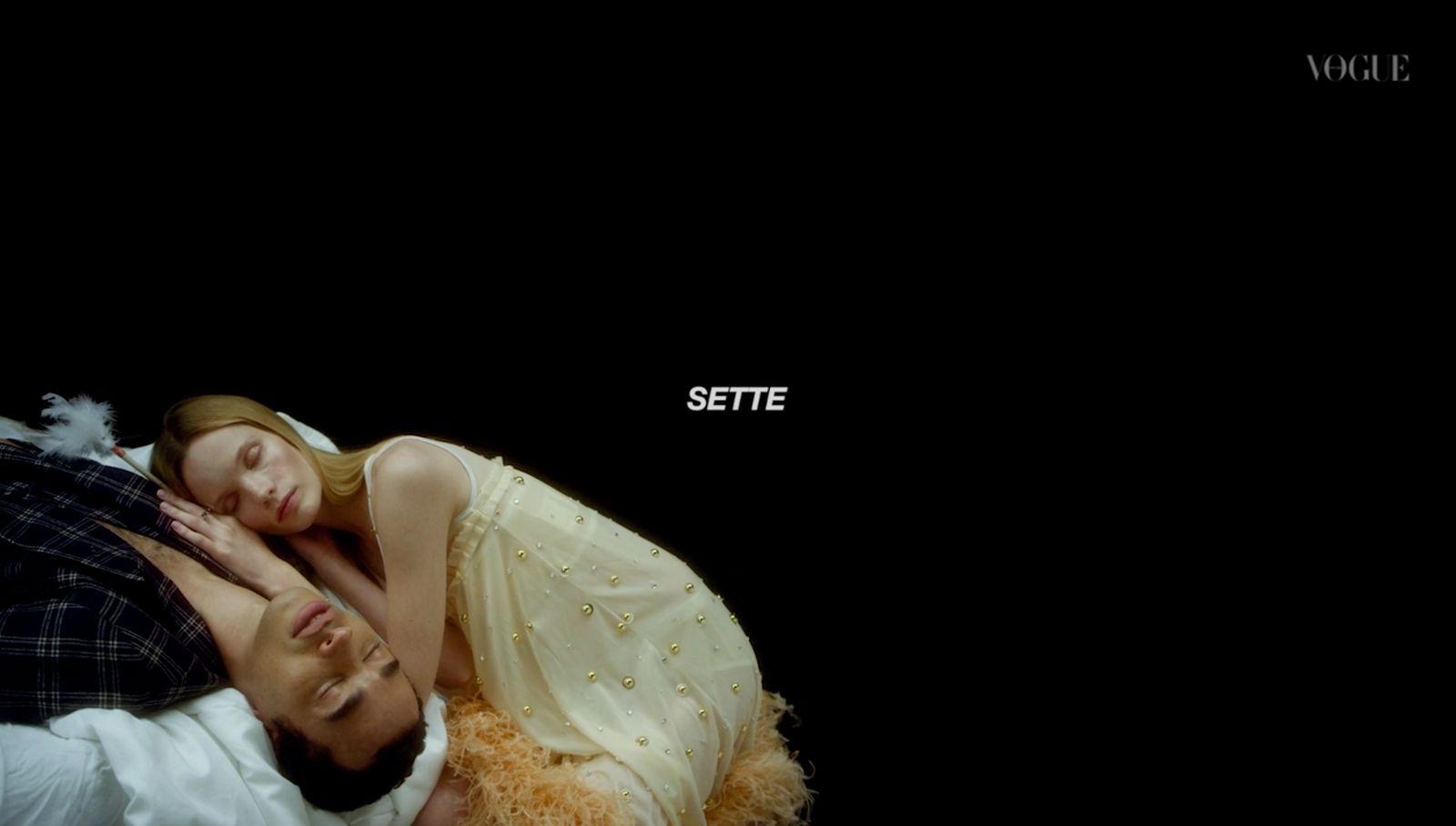 a man and a woman laying on top of each other