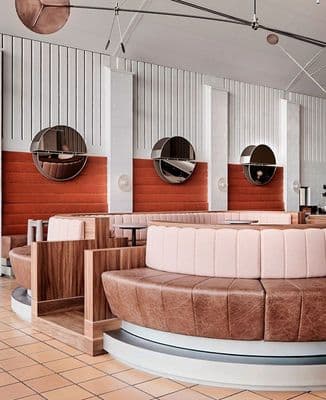 a restaurant with round mirrors on the wall