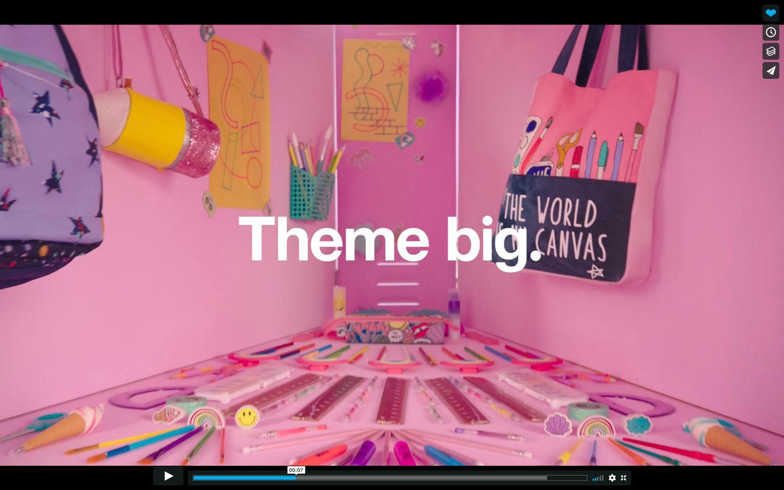 a pink room with a pink wall and a pink table