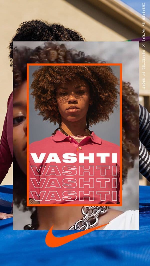 a woman with an afro is holding a poster
