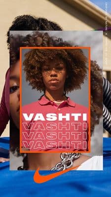 a woman with an afro is holding a poster