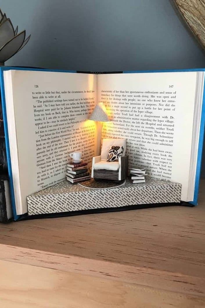an open book sitting on top of a wooden table