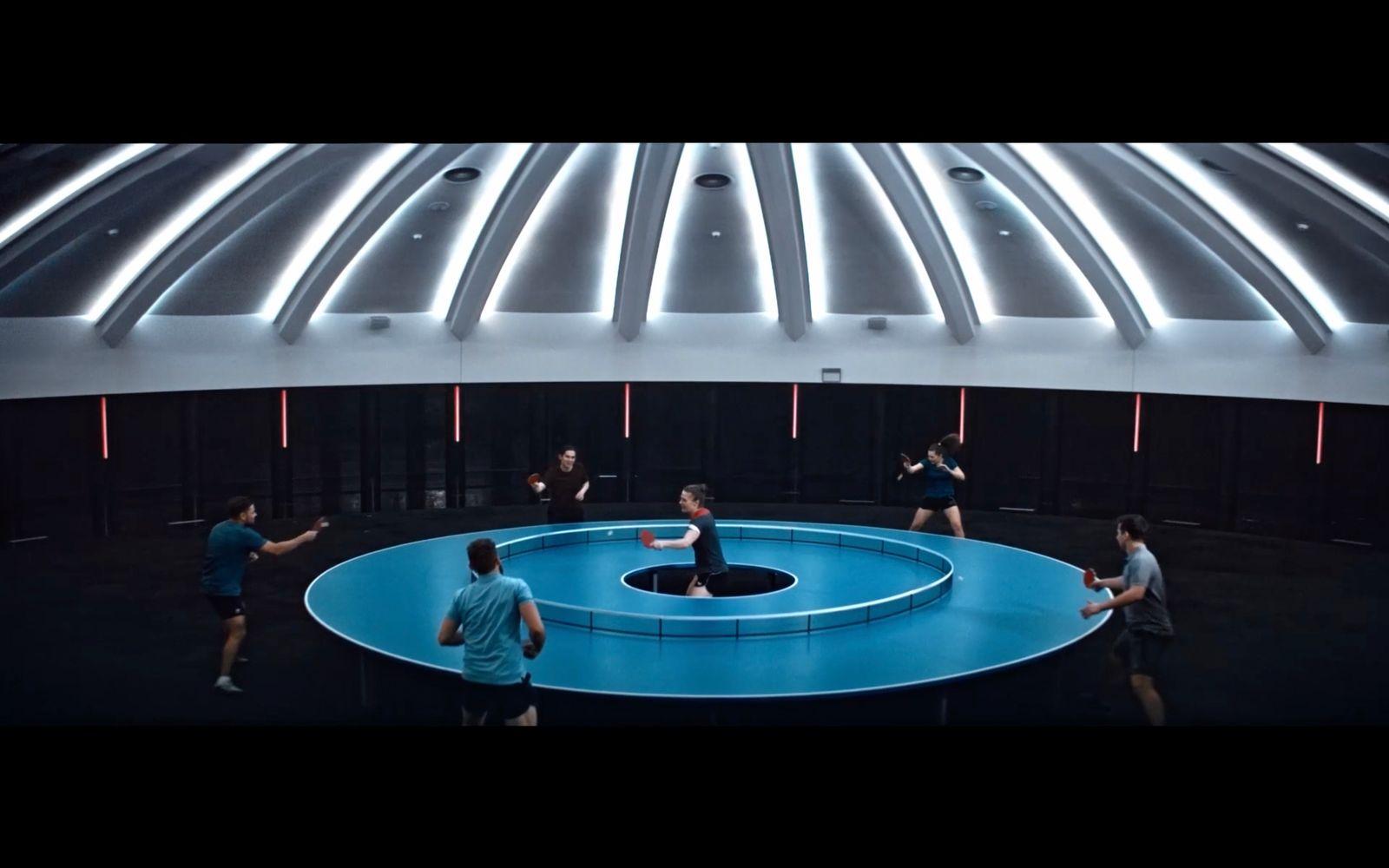 a group of people playing a game of frisbee