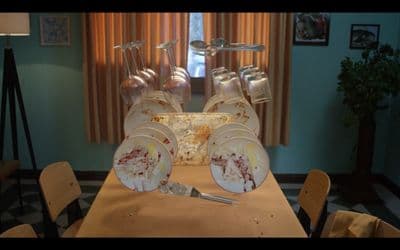 a wooden table topped with lots of dirty dishes