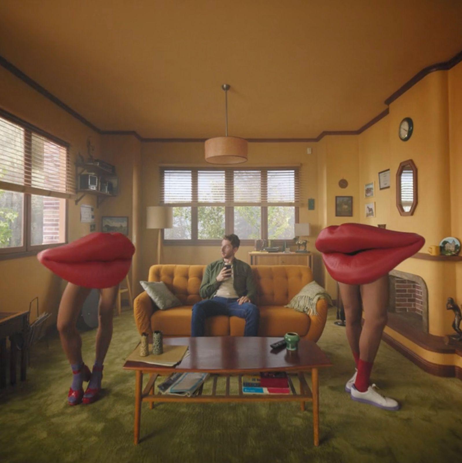 a man sitting on a couch in a living room